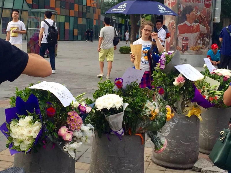 Flower Memorials at Site of Sanlitun Stabbings Regularly Cleared Away by Security