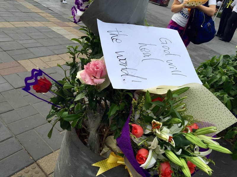 Flower Memorials at Site of Sanlitun Stabbings Regularly Cleared Away by Security