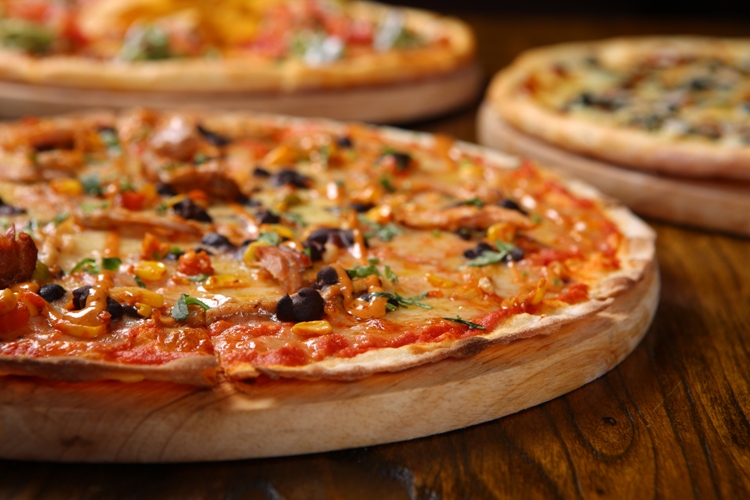 Pizza Profile: QMex Surprises With Generously-Topped Crispy Thin Crust Pizzas