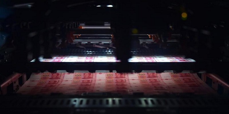 A Peek at The New 100 Yuan NoteNew 100-yuan notes being coded by the machine